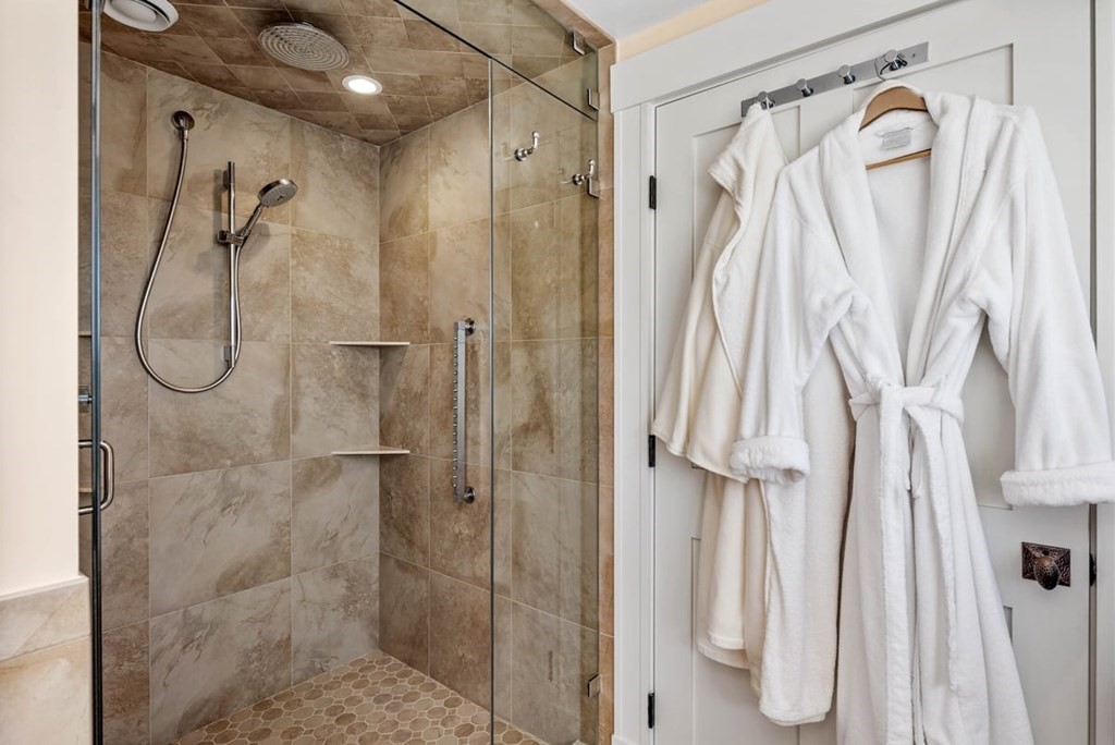 13 Beacon Road Hull, MA 02045 - Photo 19 of 41 a bathroom with a shower and a glass door