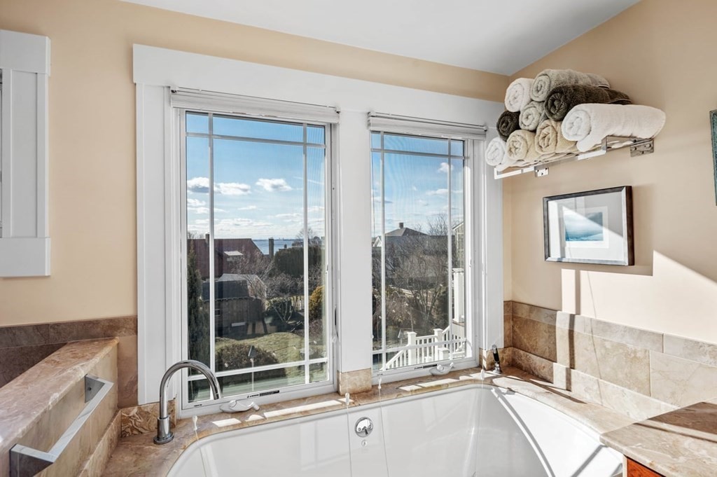 13 Beacon Road Hull, MA 02045 - Photo 20 of 41 a room with a large mirror and furniture