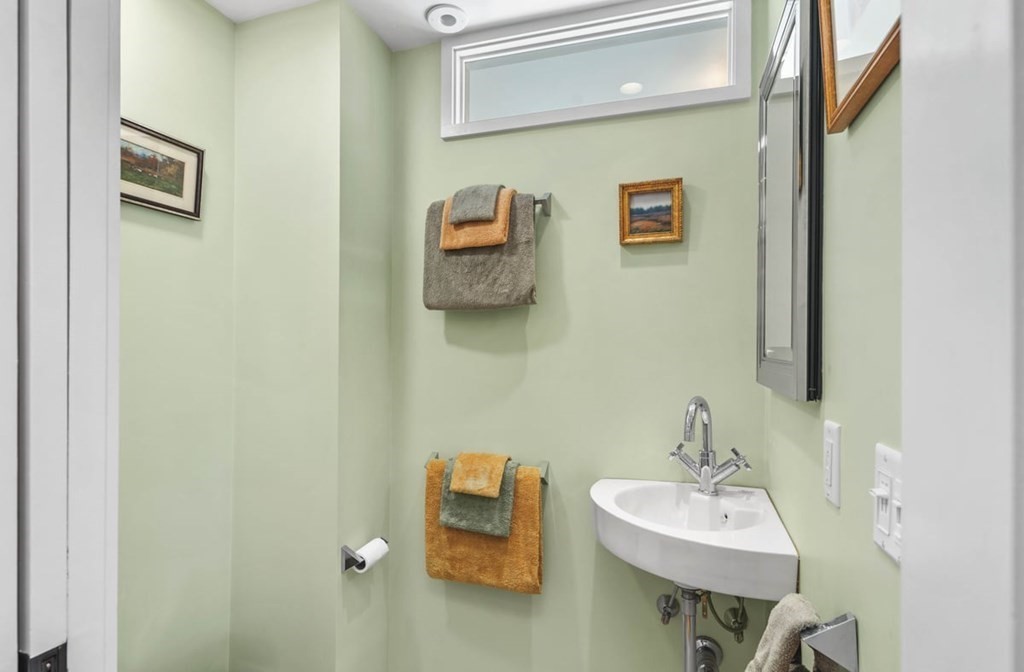 13 Beacon Road Hull, MA 02045 - Photo 22 of 41 a bathroom with a sink and a mirror