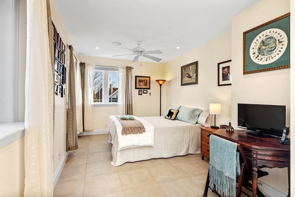 13 Beacon Road Hull, MA 02045 - Photo 27 of 41 a bedroom with a bed and a flat screen tv