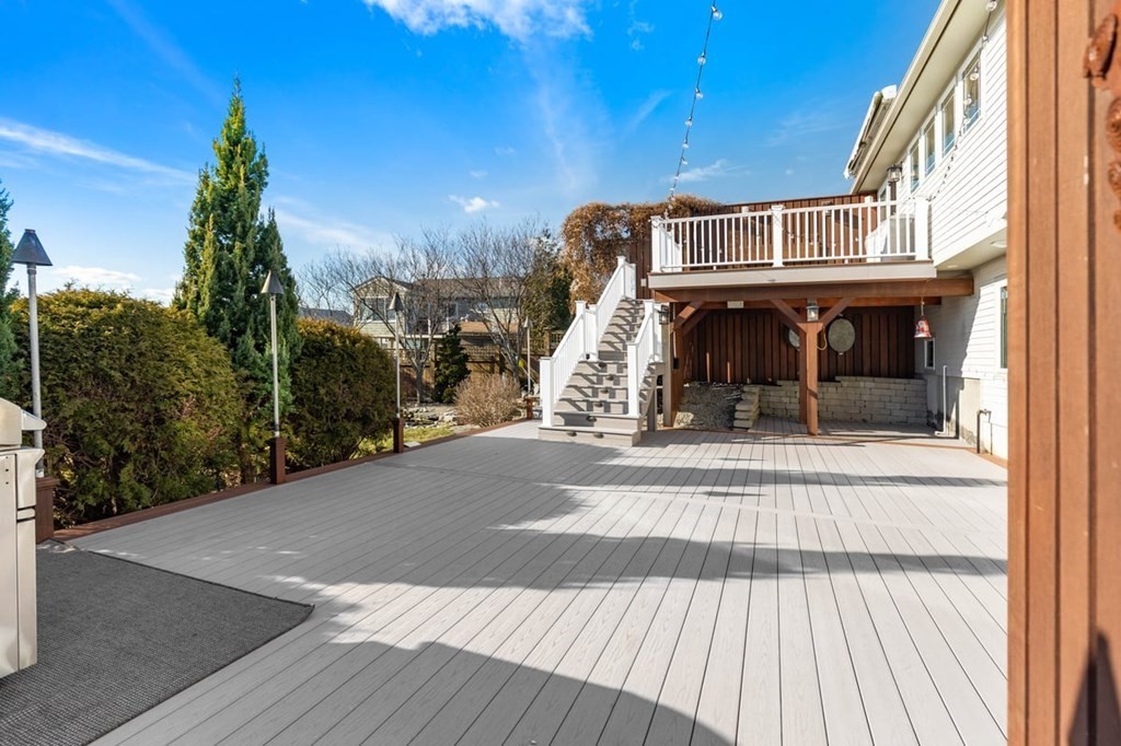 13 Beacon Road Hull, MA 02045 - Photo 32 of 41 a view of a brick building next to a yard