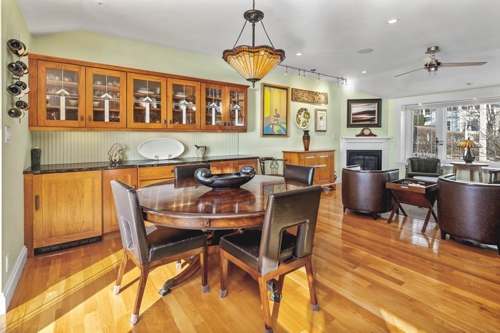 13 Beacon Road Hull, MA 02045 - Photo 9 of 41 a dining room with furniture a chandelier and wooden floor