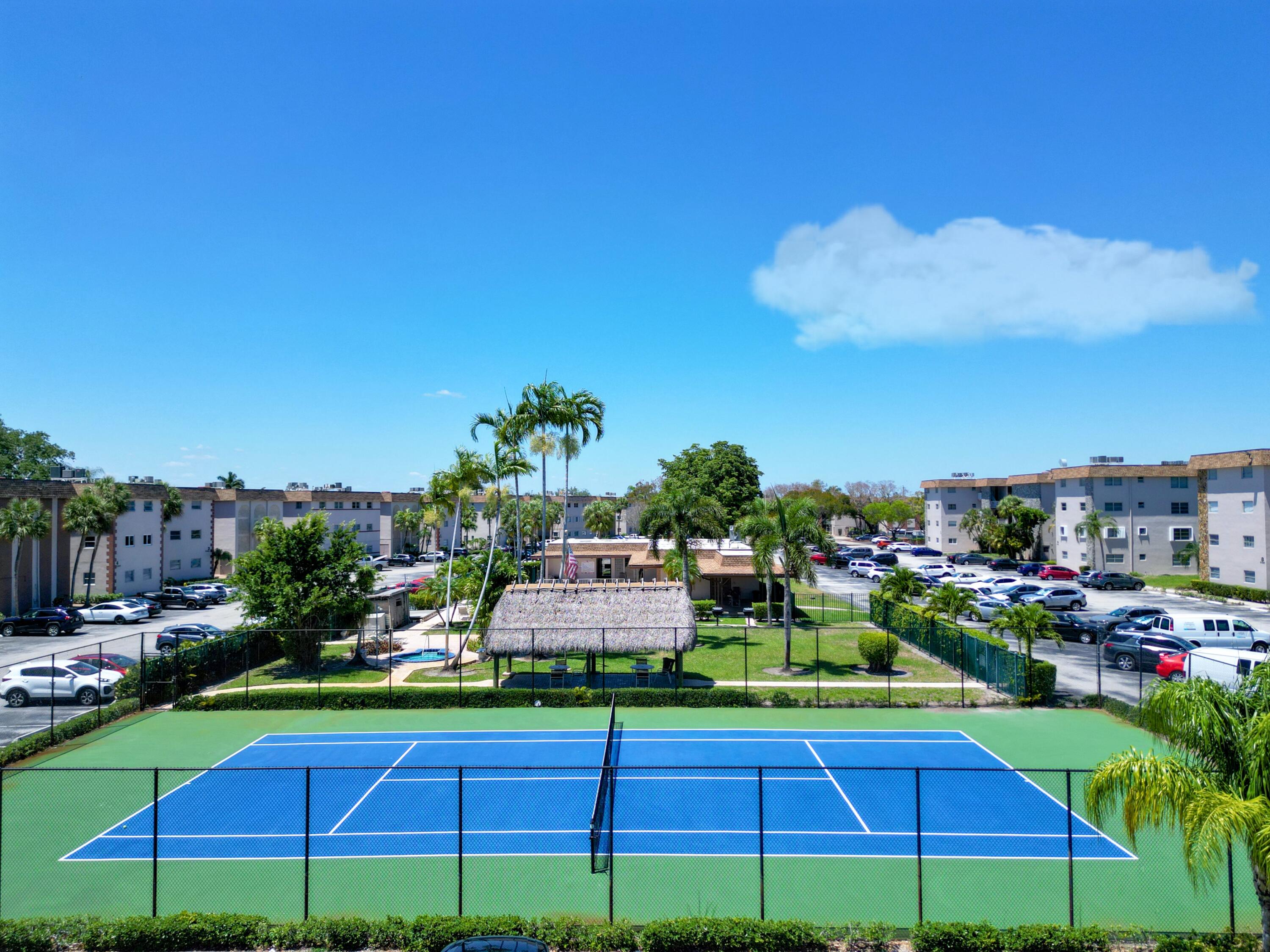 2430 Southwest 81st Avenue, Unit 108 Davie, FL 33324 - Photo 13 of 18 a view of a chairs and table in the backyard