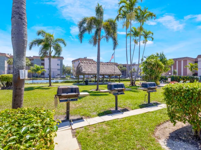 a swimming pool with yard and outdoor seating