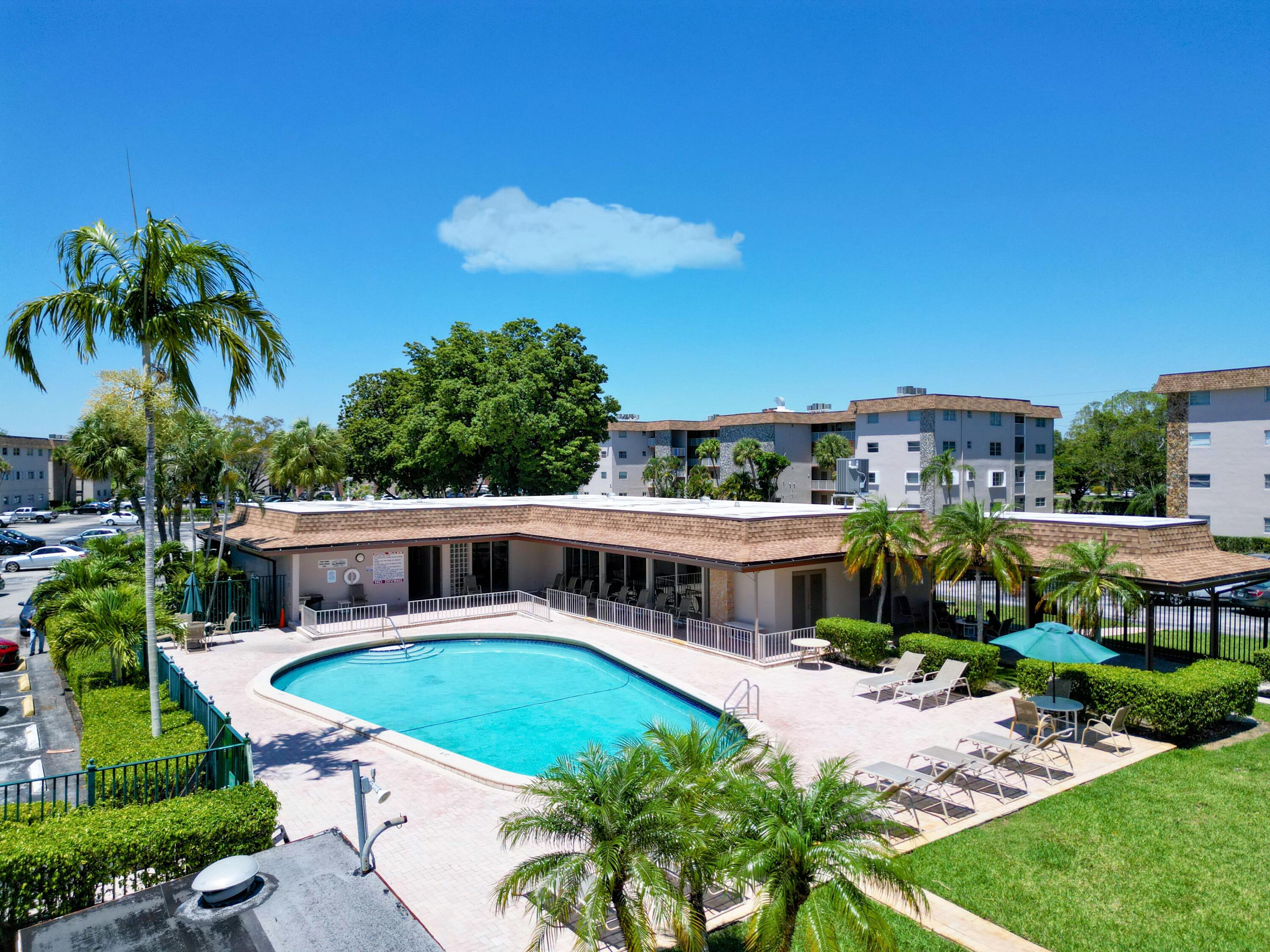 2430 Southwest 81st Avenue, Unit 108 Davie, FL 33324 - Photo 16 of 18 a view of a house with backyard porch and sitting area