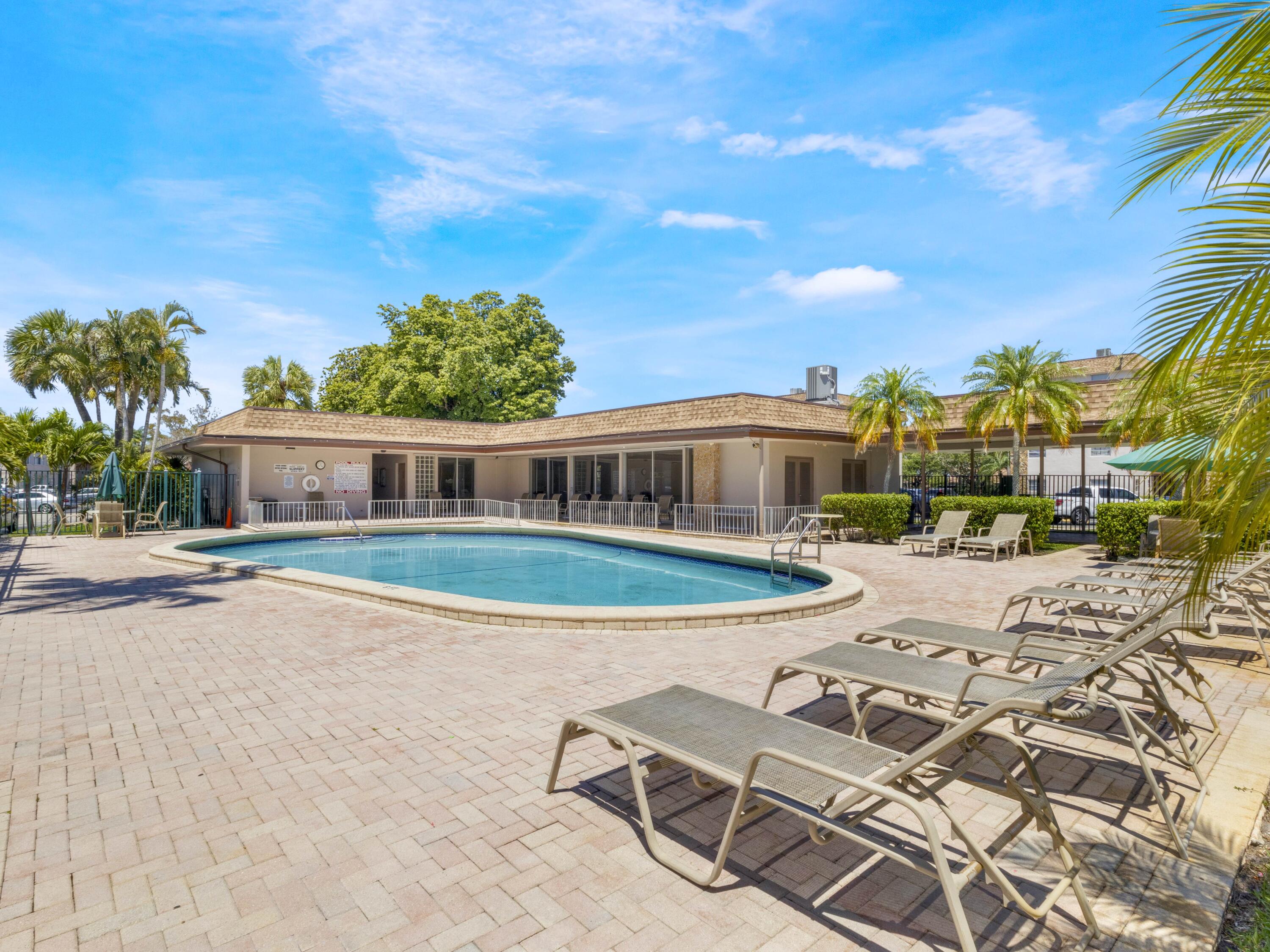 2430 Southwest 81st Avenue, Unit 108 Davie, FL 33324 - Photo 17 of 18 a front view of a house with garden