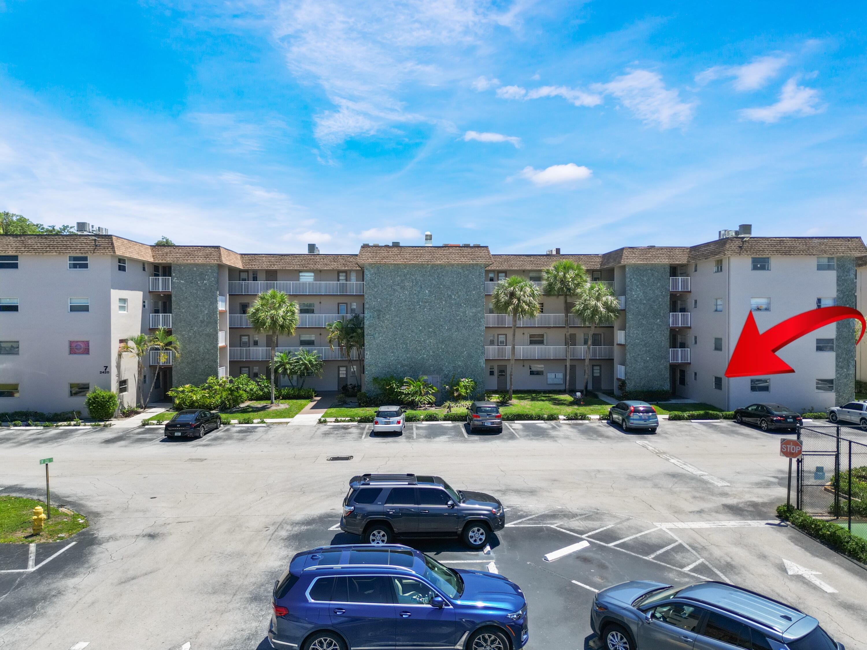 2430 Southwest 81st Avenue, Unit 108 Davie, FL 33324 - Photo 18 of 18 a swimming pool with buildings in the background