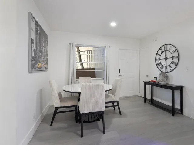 a view of a livingroom with furniture and a table