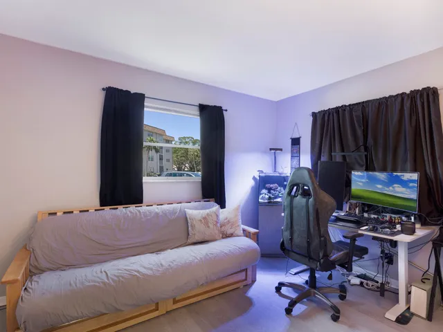 a living room with a couch and a window