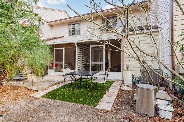 a view of a backyard with a garden and entertaining space