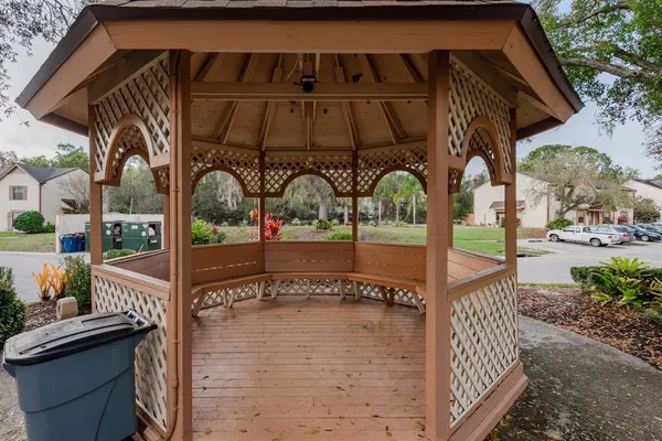 a sign of golf club on a tree