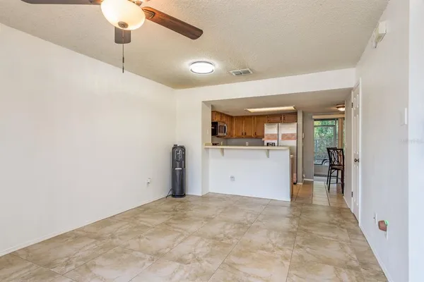 a view of a kitchen with a sink and cabinets
