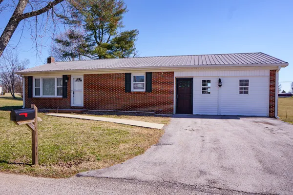 a house with trees in the background