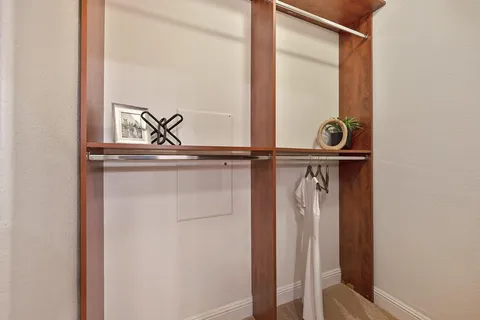 a view of an empty room with windows