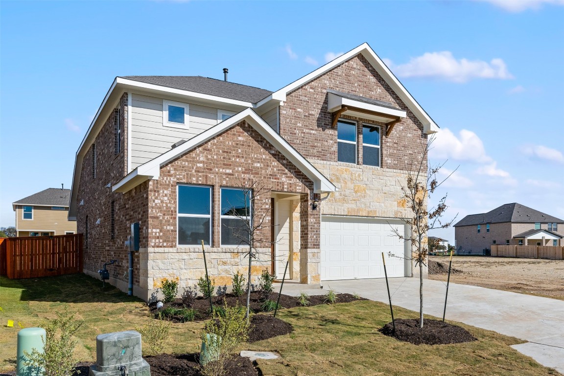 1013 Smudge Way Georgetown, TX 78633 - Photo 1 of 1 a front view of a house with garden