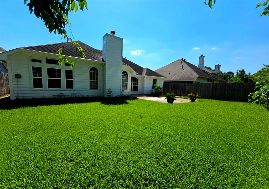 13618 Sablegrove Lane Houston, TX 77014 - Photo 26 of 30 a front view of a house with garden