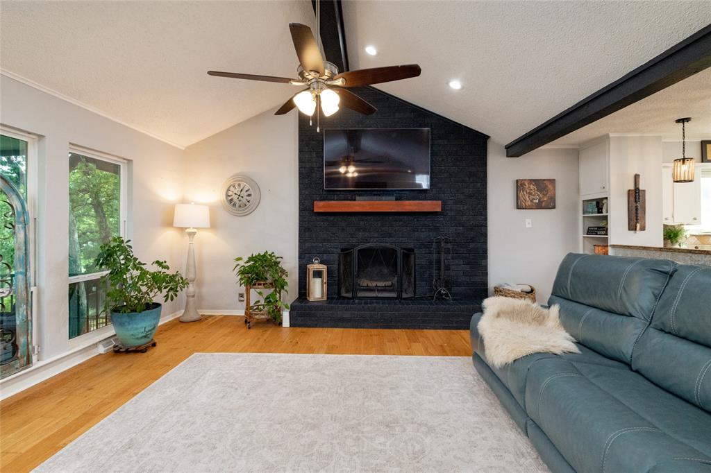 205 Timberlake Drive Azle, TX 76020 - Photo 10 of 40 a living room with furniture and a fireplace