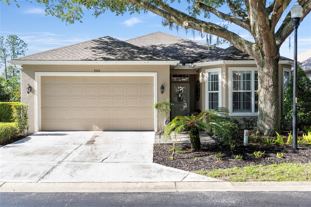 3304 Southwest 38th Street Ocala, FL 34474 - Photo 2 of 21 a front view of a house with garden