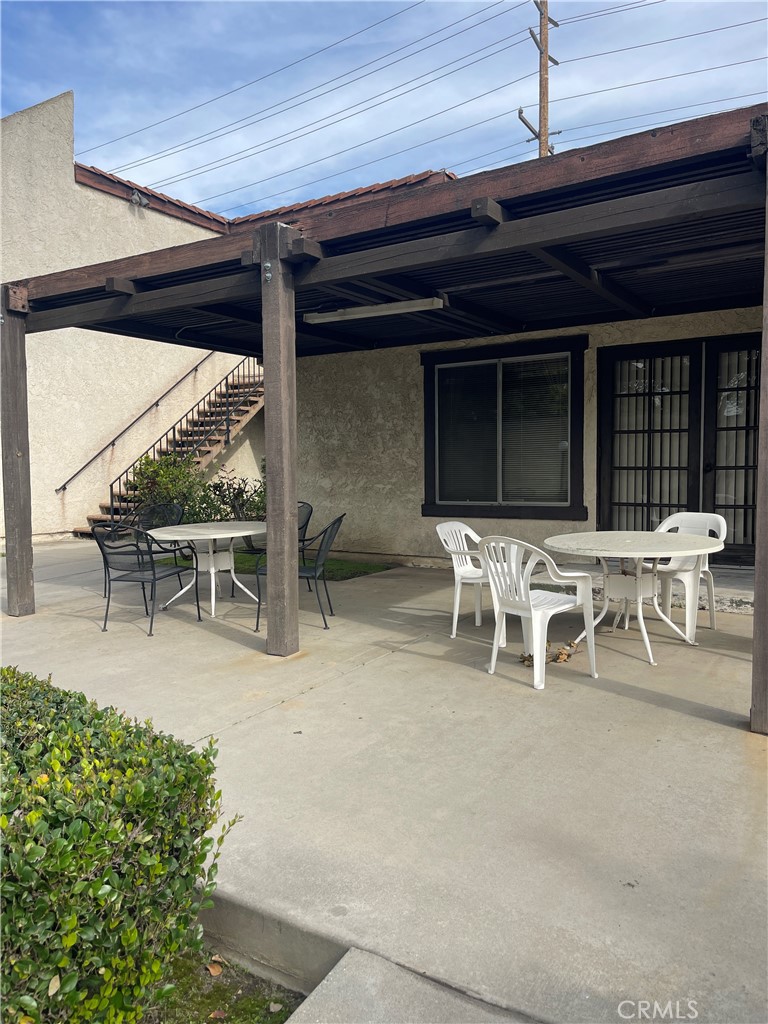 4501 Peck Road, Unit 9 El Monte, CA 91732 - Photo 12 of 16 a patio with table and chairs