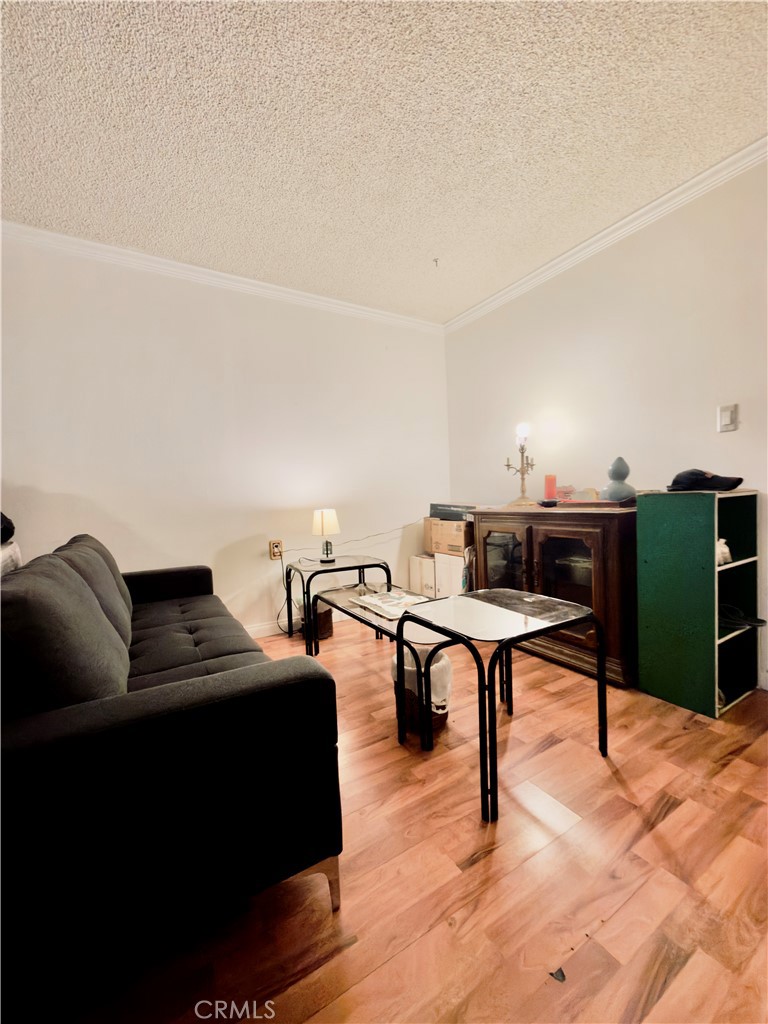 4501 Peck Road, Unit 9 El Monte, CA 91732 - Photo 3 of 17 a living room with furniture and a wooden floor