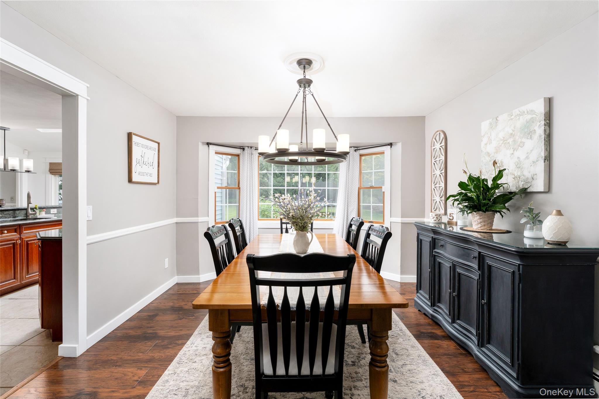 8 Miller Avenue Shoreham, NY 11786 - Photo 12 of 36 a dining room with furniture potted plants and wooden floor