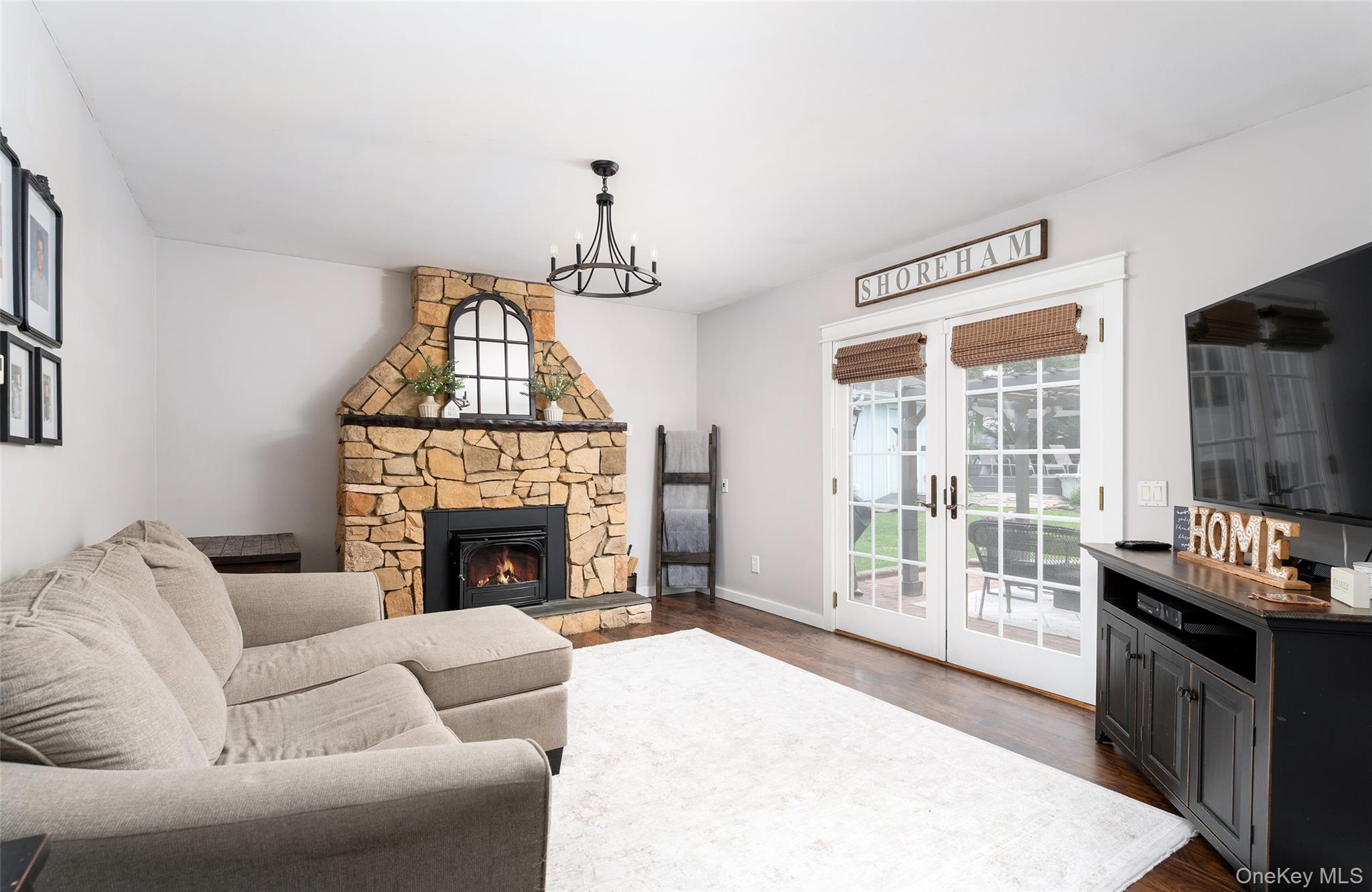 8 Miller Avenue Shoreham, NY 11786 - Photo 13 of 36 a living room with furniture and a fireplace