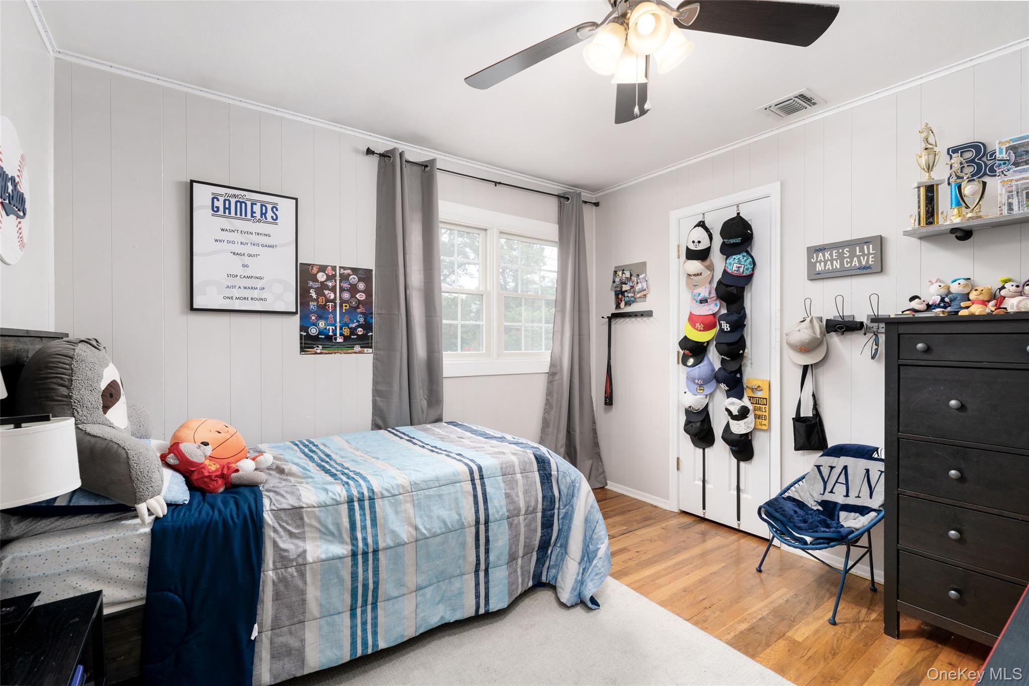 8 Miller Avenue Shoreham, NY 11786 - Photo 22 of 36 a bedroom with a bed and a dresser in it