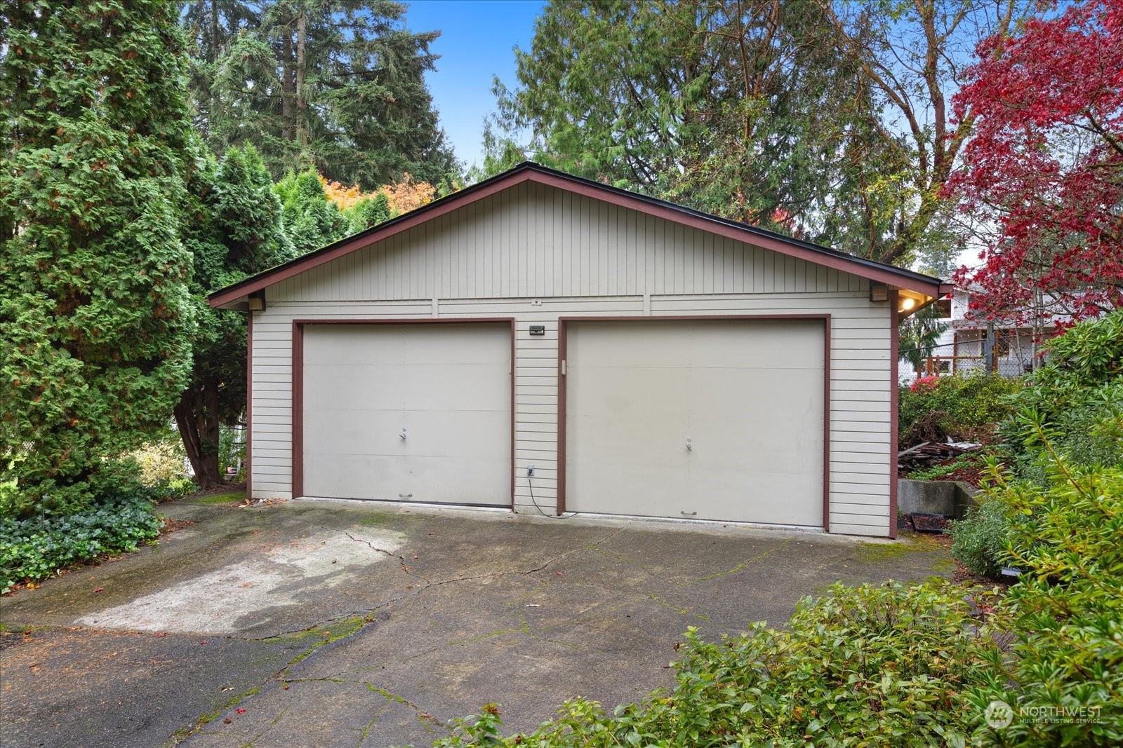 107 219th Place Southeast Bothell, WA 98021 - Photo 13 of 40 a view of garage yard and tree