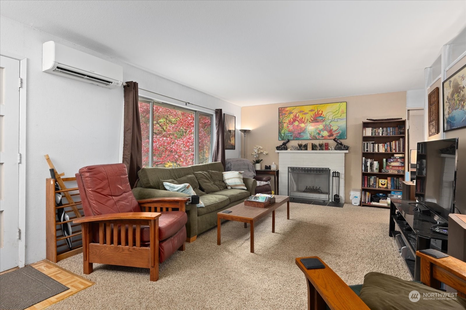 107 219th Place Southeast Bothell, WA 98021 - Photo 15 of 40 a living room with furniture a fireplace and a flat screen tv
