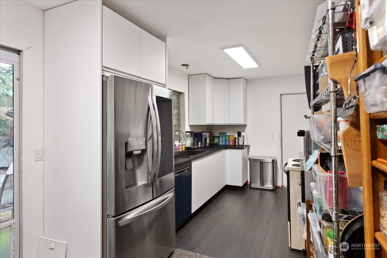 107 219th Place Southeast Bothell, WA 98021 - Photo 18 of 40 a kitchen with stainless steel appliances a refrigerator and a cabinets