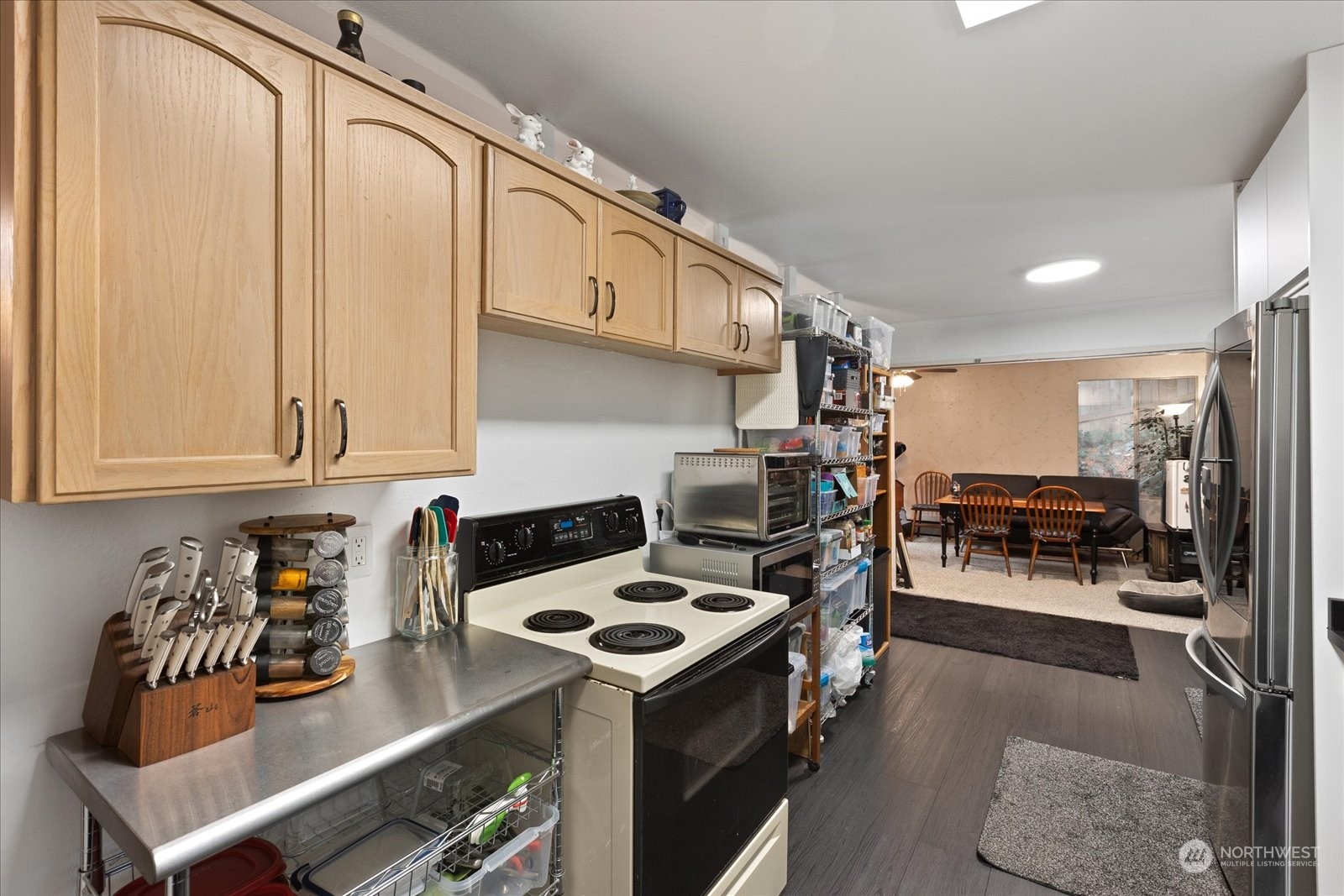 107 219th Place Southeast Bothell, WA 98021 - Photo 21 of 40 a kitchen with stainless steel appliances granite countertop a stove and a refrigerator
