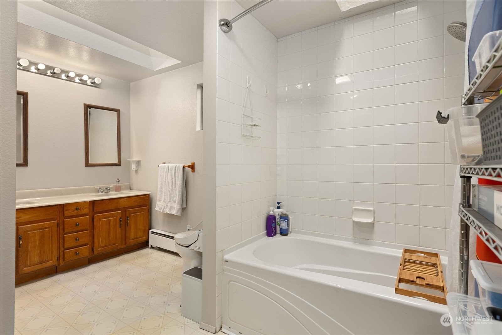 107 219th Place Southeast Bothell, WA 98021 - Photo 26 of 40 a bathroom with a tub sink and mirror