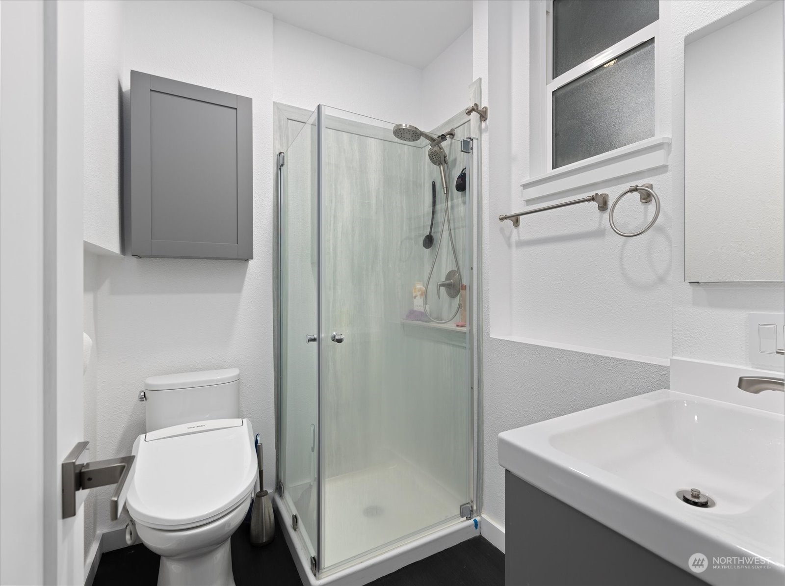 107 219th Place Southeast Bothell, WA 98021 - Photo 34 of 40 a bathroom with a sink toilet and shower