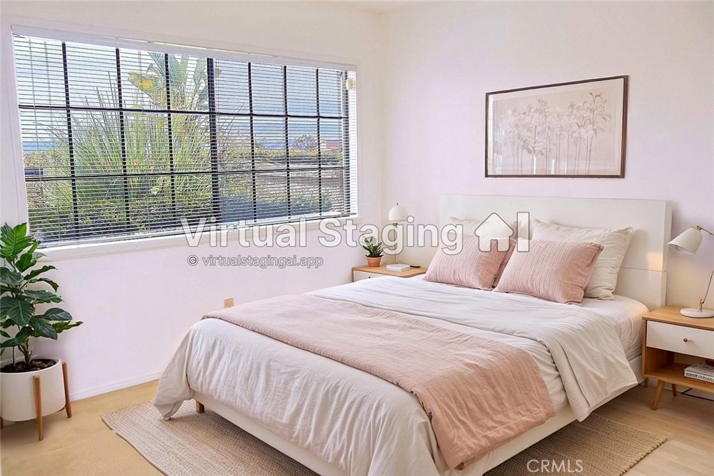 6508 Sandy Point Court Rancho Palos Verdes, CA 90275 - Photo 34 of 66 a bedroom with a large bed and a potted plant