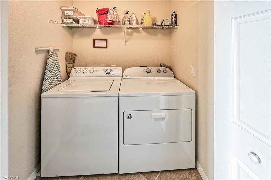9735 Acqua Court, Unit 622 Naples, FL 34113 - Photo 16 of 34 a utility room with dryer and washer