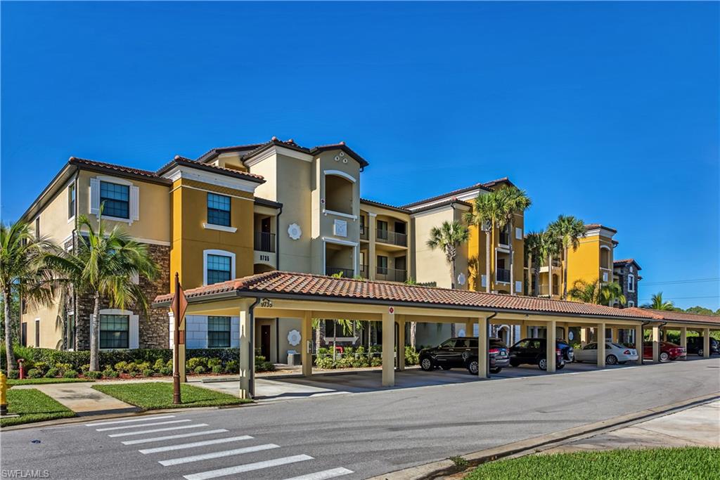 9735 Acqua Court, Unit 622 Naples, FL 34113 - Photo 2 of 34 a front view of a building with street view