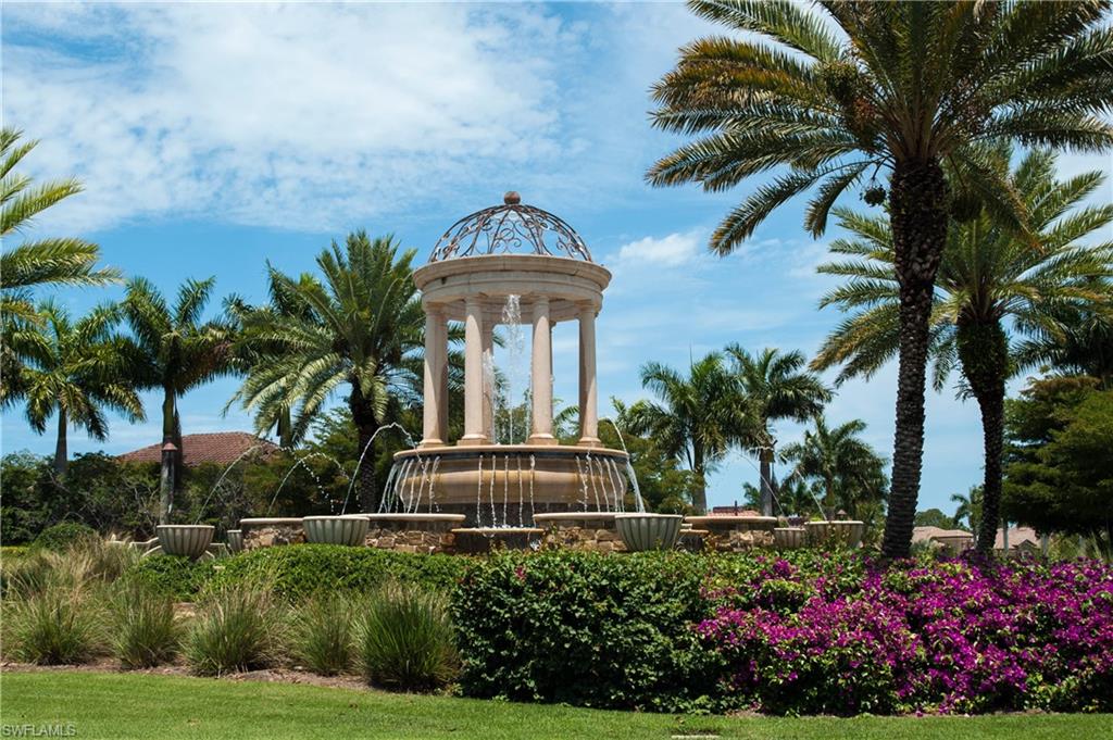 9735 Acqua Court, Unit 622 Naples, FL 34113 - Photo 32 of 34 a front view of a house with a garden