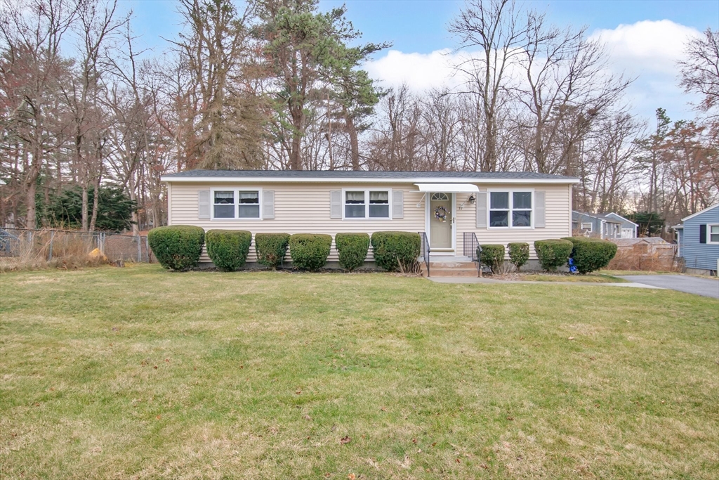front view of a house next to a yard