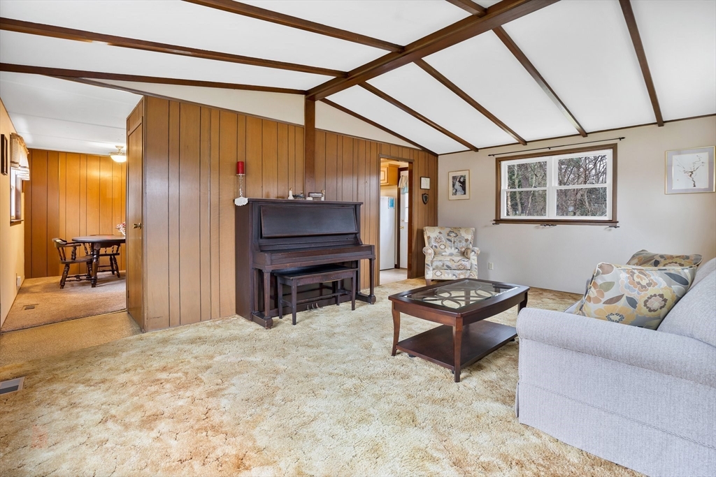 37 Ruthven Street Springfield, MA 01128 - Photo 11 of 24 a living room with furniture and a piano