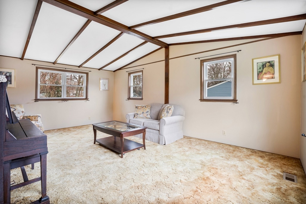 37 Ruthven Street Springfield, MA 01128 - Photo 13 of 24 a living room with furniture and paintings on the wall