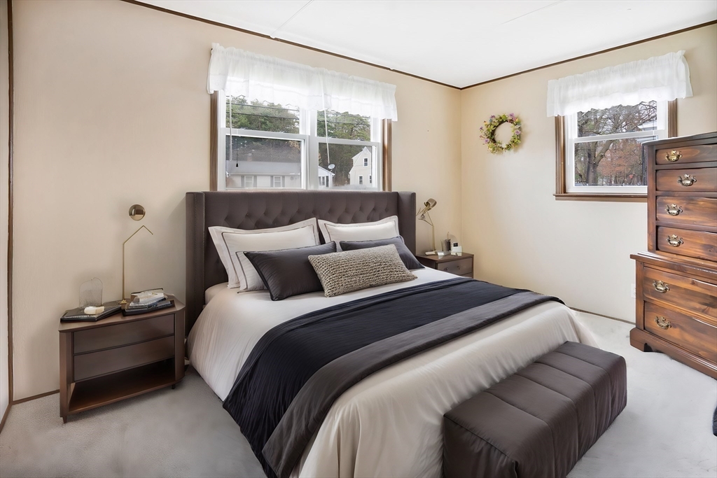 37 Ruthven Street Springfield, MA 01128 - Photo 16 of 24 a bedroom with a bed and wooden floor