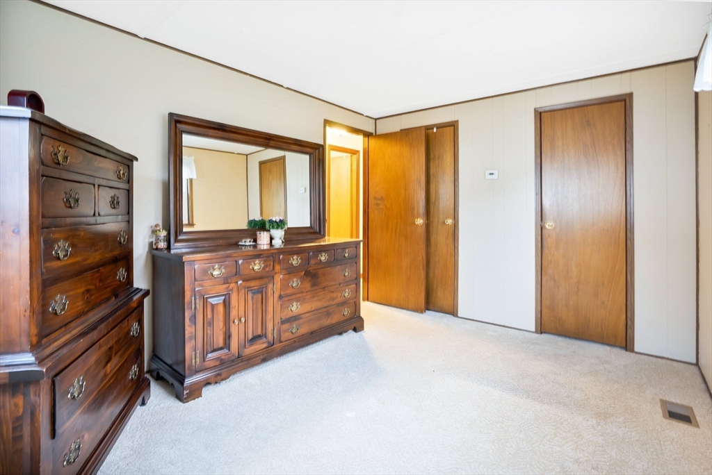 37 Ruthven Street Springfield, MA 01128 - Photo 17 of 24 a view of an empty room with window and chandelier