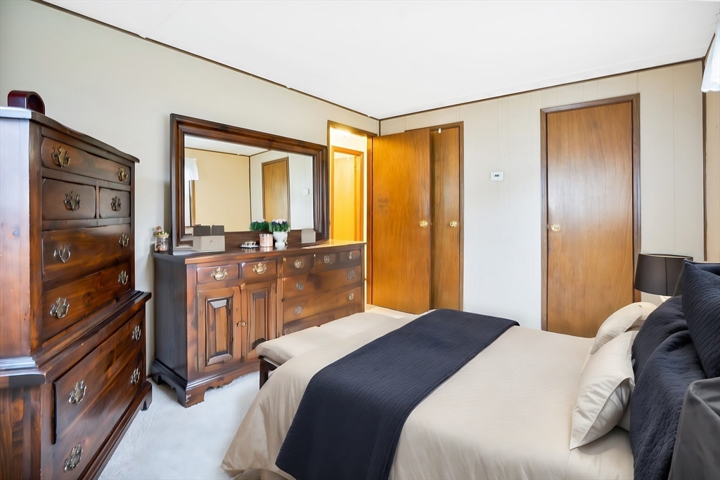 37 Ruthven Street Springfield, MA 01128 - Photo 18 of 24 a bedroom with a bed and wooden floor