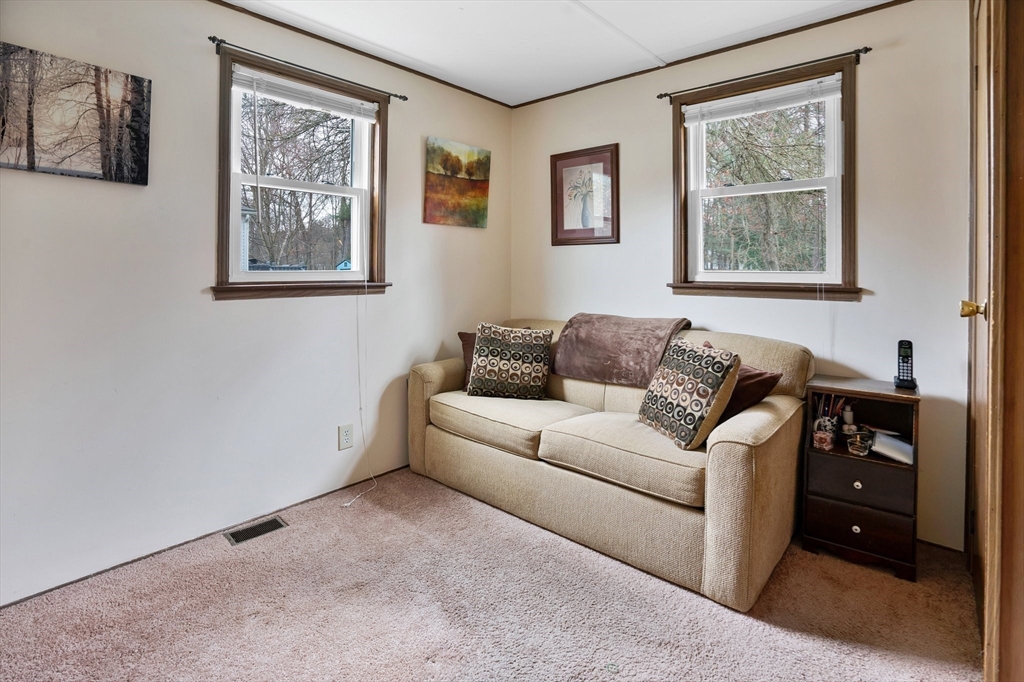 37 Ruthven Street Springfield, MA 01128 - Photo 19 of 24 a living room with furniture and a window