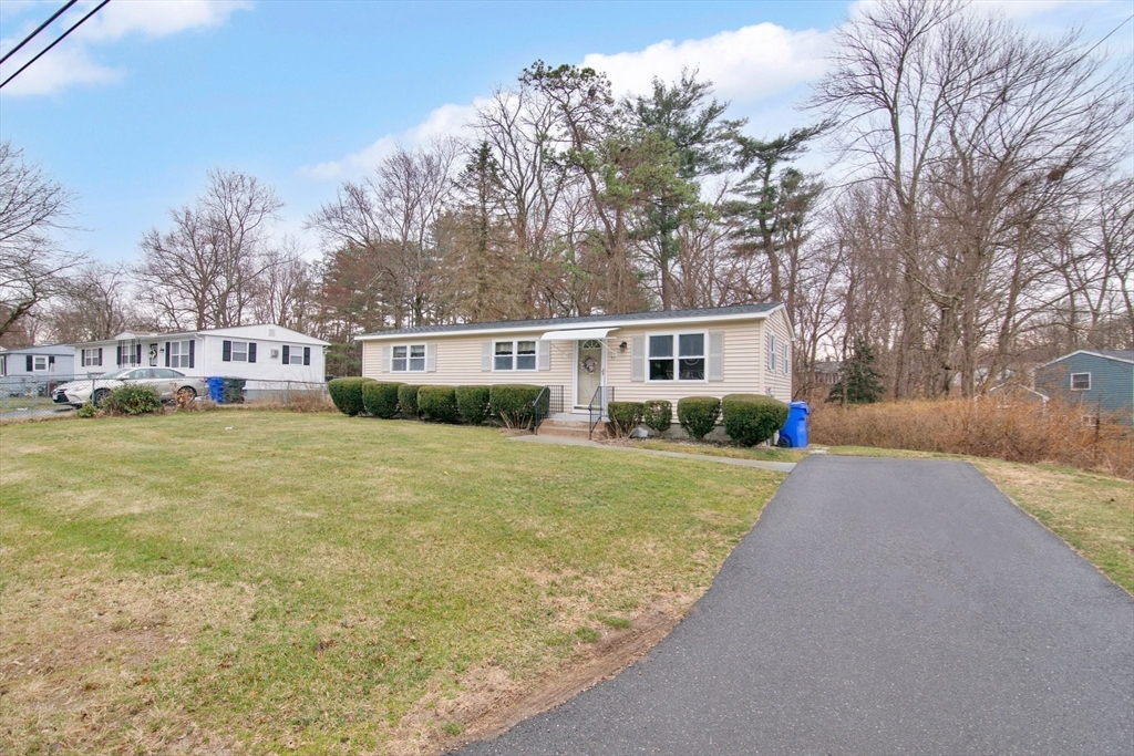 37 Ruthven Street Springfield, MA 01128 - Photo 24 of 24 a view of a house with a yard and garage