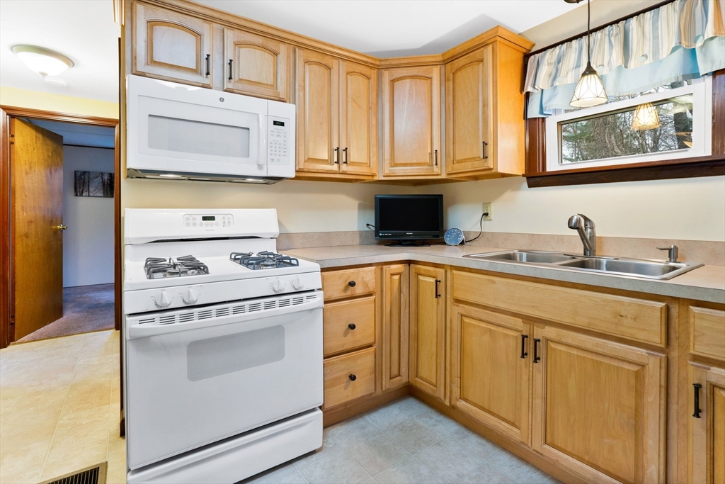 37 Ruthven Street Springfield, MA 01128 - Photo 4 of 24 a kitchen with cabinets appliances and a sink