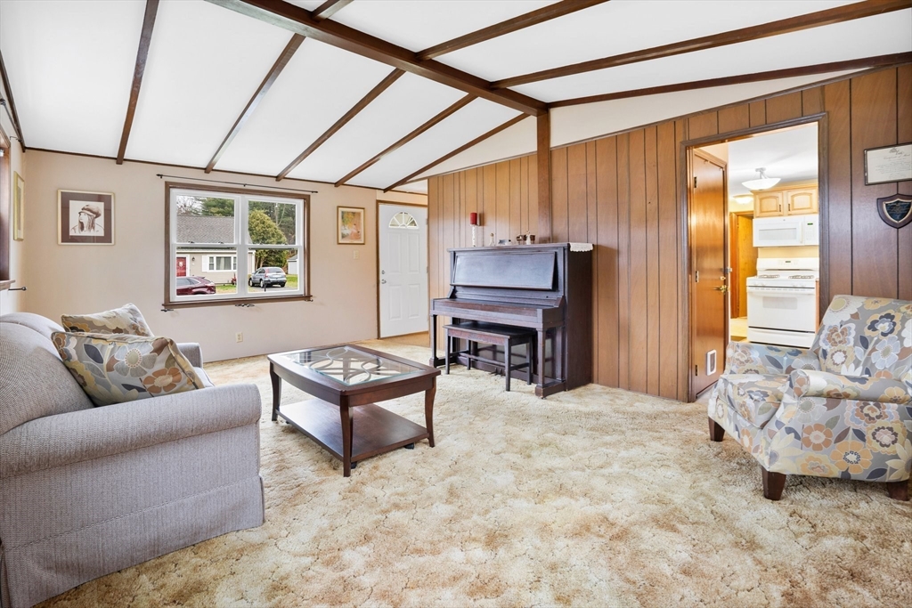 37 Ruthven Street Springfield, MA 01128 - Photo 10 of 24 a living room with furniture and a flat screen tv