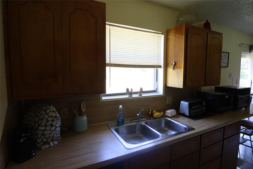 39 Oakcrest Drive Ranger, TX 76470 - Photo 11 of 25 a bathroom with a sink and a window