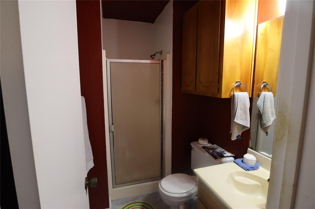 39 Oakcrest Drive Ranger, TX 76470 - Photo 23 of 25 a white toilet sitting next to a bathroom sink