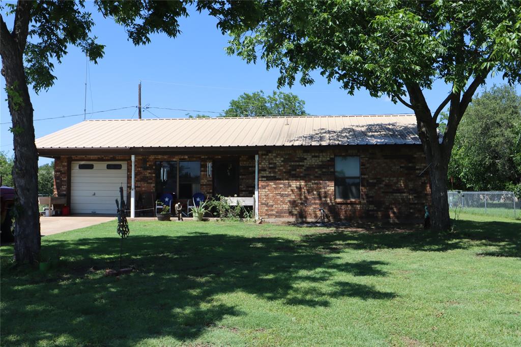 39 Oakcrest Drive Ranger, TX 76470 - Photo 3 of 25 a view of a house with a yard porch and sitting area